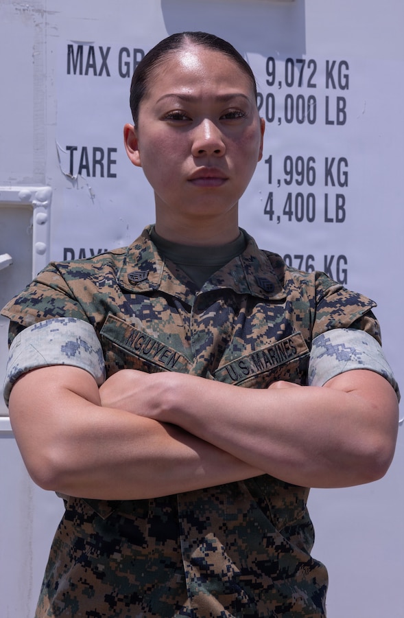 U.S. Marine Corps Staff Sgt. Hongnhung Nguyen, an aviation precision measurement equipment technician with Marine Aviation Logistics Squadron (MALS) 12, Marine Aircraft Group 12, 1st Marine Aircraft Wing, poses for a photo at Marine Corps Air Station Iwakuni, Japan, July 22, 2026. Previously serving as a drill instructor, Nguyen now applies that experience to mentor and lead Marines within her shop. (U.S. Marine Corps photo by Cpl. Ella Cadby)