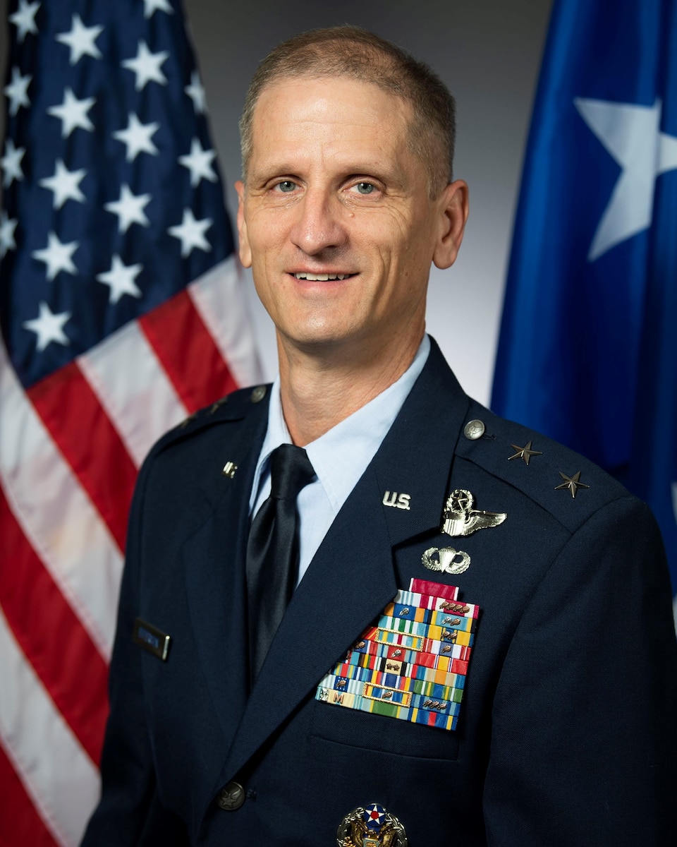 Maj. Gen. Randal Efferson posing for an official photo in front of the U.S. Flag