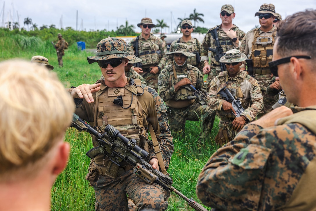 U.S. Marine Corps Sgt. Peyton Sherman, a squad leader with Bravo Company, 1st Battalion, 6th Marine Regiment, 2nd Marine Division discusses procedures during an objective rally point class at Base Aeronaval Cristobal Colón, Panama, Aug. 4, 2026, as part of PANAMAX 2026. PANAMAX 2026 seeks to improve interoperability and strengthen collective capacity to conduct complex multinational and all-domain operations to ensure the free flow of commerce through the Panama Canal and maintain security and stability in the region. (U.S. Marine Corps photo by Lance Cpl. Dominic Trujillo)