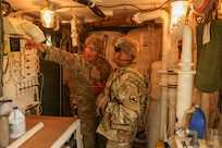 Army Reserve Cpl. Emerson Villatoro, a water treatment specialist with the 250th Quartermaster Company, explains the water treatment process to Command Sgt. Maj. Freddy Trejo, CSM 84th Training Command,, August 4, 2026, at Fort McCoy, Wis. The 250th Quartermaster Company provides potable water during WAREX26.(U.S. Army Reserve photo by Sgt. 1st Class Justin Hardin)
