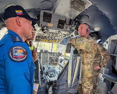 Lt. Col. Tim Ori, right, officer in charge of a Kentucky National Guard 123rd Medical Group Critical Care Air Transport Team, meets with members of the Ecuadorian Air Force during a five-day information exchange in Ecuador.