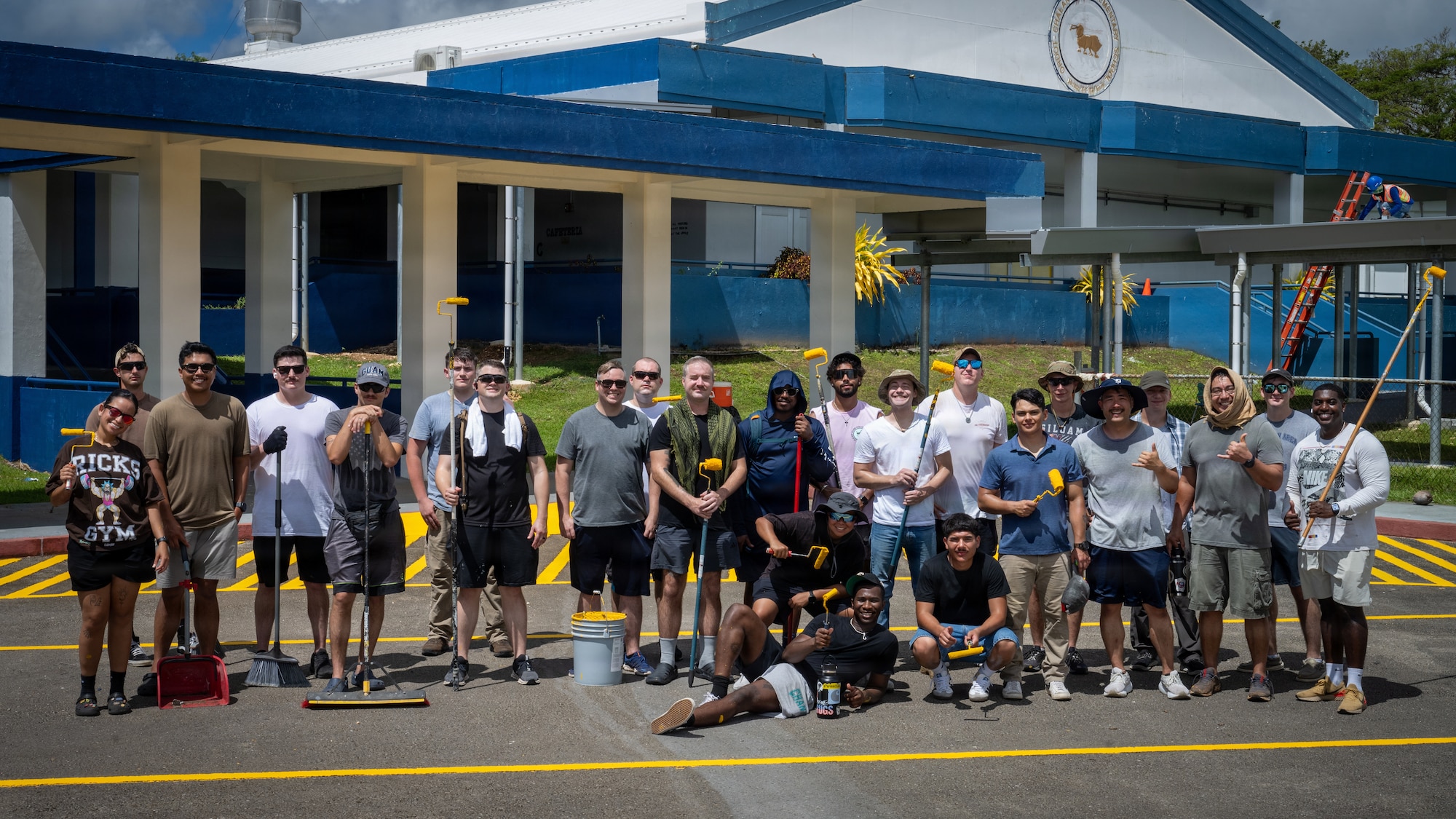 U.S. Airmen assigned to the 21st Air Task Force pose for a group photo outside Chalan Pago-Ordot Elementary School, Guam, June 12, 2026. The volunteer effort supported recovery at local schools while strengthening partnerships between the 21st ATF and the Guam community following Super Typhoon Sinlaku and Super Typhoon Bavi. (U.S. Air Force photo by Senior Airman Adrien Tran)