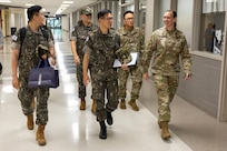 U.S. Army Col. Michelle M. Williams, U.S. Army Financial Management Command commander, right, talks with Republic of Korea Army finance officers after welcoming them to the Maj. Gen. Emmett J. Bean Federal Center in Indianapolis July 9, 2026. Pictured from left are ROKA Maj. Kyung Hyun Ko, ROKA Planning Department budget officer; ROKA Col. Jung Keuk Ki, ROKA Planning Department Financial Accounting chief; ROKA Brig. Gen. Woo Yang Woo, ROKA Director of the Budget and Finance Branch chief; U.S. Army Master Sgt. Jeong Jin, USAFMCOM Strategic Initiatives Group noncommissioned officer in charge; and Williams. (U.S. Army photo by Mark R. W. Orders-Woempner)