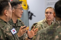 Republic of Korea Army Brig. Gen. Woo Yang Woo, ROKA Director of the Budget and Finance Branch chief, center left, talks as U.S. Army Col. Michelle M. Williams, U.S. Army Financial Management Command commander, center right, listens alongside ROKA Col. Jung Keuk Ki, ROKA Planning Department Financial Accounting chief, far left, and ROKA Maj. Kyung Hyun Ko, ROKA Planning Department budget officer, far right, at the Maj. Gen. Emmett J. Bean Federal Center in Indianapolis July 9, 2026. The ROKA finance officers visited USAFMCOM after a trip to the Office of the Assistant Secretary of the Army for Financial Management and Comptroller at the Pentagon and before heading to the U.S. Army Finance and Comptroller School at Fort Jackson, S.C., where they learned about the structure and operations of the U.S. Army Finance Corps. (U.S. Army photo by Mark R. W. Orders-Woempner)