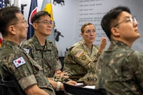 U.S. Army Col. Michelle M. Williams, U.S. Army Financial Management Command commander, center right, provides a briefing as Republic of Korea Army Brig. Gen. Woo Yang Woo, ROKA Director of the Budget and Finance Branch chief, center left, listens alongside ROKA Col. Jung Keuk Ki, ROKA Planning Department Financial Accounting chief, far left, and ROKA Maj. Kyung Hyun Ko, ROKA Planning Department budget officer, far right, at the Maj. Gen. Emmett J. Bean Federal Center in Indianapolis July 9, 2026. The ROKA finance officers visited USAFMCOM after a trip to the Office of the Assistant Secretary of the Army for Financial Management and Comptroller at the Pentagon and before heading to the U.S. Army Finance and Comptroller School at Fort Jackson, S.C., where they learned about the structure and operations of the U.S. Army Finance Corps. (U.S. Army photo by Mark R. W. Orders-Woempner)