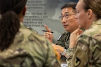 Republic of Korea Army Col. Jung Keuk Ki, ROKA Planning Department Financial Accounting chief, far left, center, talks as U.S. Army Col. Michelle M. Williams, U.S. Army Financial Management Command commander, right, and U.S. Army Command Sgt. Maj. Joy L. Allen, USAFMCOM senior enlisted advisor, left, listen at the Maj. Gen. Emmett J. Bean Federal Center in Indianapolis July 9, 2026. The ROKA finance officers visited USAFMCOM after a trip to the Office of the Assistant Secretary of the Army for Financial Management and Comptroller at the Pentagon and before heading to the U.S. Army Finance and Comptroller School at Fort Jackson, S.C., where they learned about the structure and operations of the U.S. Army Finance Corps. (U.S. Army photo by Mark R. W. Orders-Woempner)