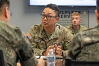 U.S. Army Master Sgt. Jeong Jin, U.S. Army Financial Management Command Strategic Initiatives Group noncommissioned officer in charge, center left, provides translation assistance to Republic of Korea finance officers as ROKA Col. Jung Keuk Ki, ROKA Planning Department Financial Accounting chief, far left, ROKA Maj. Kyung Hyun Ko, ROKA Planning Department budget officer, far right, and Col. Christopher G. Harris, 45th Finance Center director, center right, listen at the Maj. Gen. Emmett J. Bean Federal Center in Indianapolis July 9, 2026. The ROKA finance officers visited USAFMCOM after a trip to the Office of the Assistant Secretary of the Army for Financial Management and Comptroller at the Pentagon and before heading to the U.S. Army Finance and Comptroller School at Fort Jackson, S.C., where they learned about the structure and operations of the U.S. Army Finance Corps. (U.S. Army photo by Mark R. W. Orders-Woempner)
