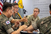 Republic of Korea Army Brig. Gen. Woo Yang Woo, ROKA Director of the Budget and Finance Branch chief, center left, talks as U.S. Army Col. Michelle M. Williams, U.S. Army Financial Management Command commander, center right, listens alongside ROKA Col. Jung Keuk Ki, ROKA Planning Department Financial Accounting chief, far left, and ROKA Maj. Kyung Hyun Ko, ROKA Planning Department budget officer, far right, at the Maj. Gen. Emmett J. Bean Federal Center in Indianapolis July 9, 2026. The ROKA finance officers visited USAFMCOM after a trip to the Office of the Assistant Secretary of the Army for Financial Management and Comptroller at the Pentagon and before heading to the U.S. Army Finance and Comptroller School at Fort Jackson, S.C., where they learned about the structure and operations of the U.S. Army Finance Corps. (U.S. Army photo by Mark R. W. Orders-Woempner)