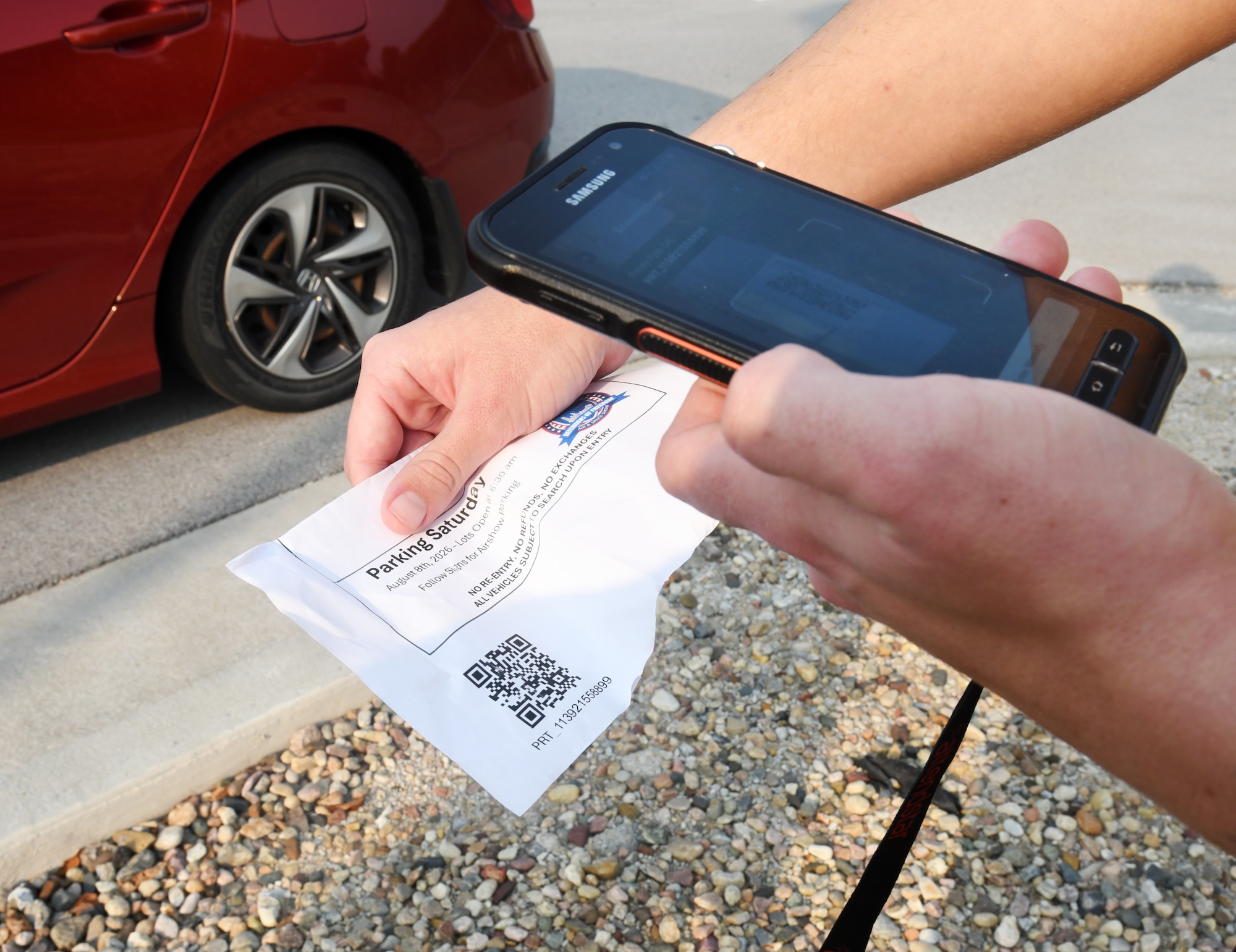 Airman Evan Asmus, 55th Aircraft Maintenance Squadron, scans a parking pass of a spectator during the 2026 Defenders of Freedom Air and Space August 8, at Offutt Air Force Base, Nebraska. Defenders of Freedom Air & Space Show 2026 served as a free, public open house to foster strong community relations and express appreciation to the local Greater Omaha community. (U.S. Air Force photo by Charles J. Haymond)
Airman Evan Asmus, 55th Aircraft Maintenance Squadron, scans a parking pass of a spectator during the 2026 Defenders of Freedom Air and Space August 8, at Offutt Air Force Base, Nebraska. Defenders of Freedom Air & Space Show 2026 served as a free, public open house to foster strong community relations and express appreciation to the local Greater Omaha community. (U.S. Air Force photo by Charles J. Haymond)
Airman Evan Asmus, 55th Aircraft Maintenance Squadron, scans a parking pass of a spectator during the 2026 Defenders of Freedom Air and Space August 8, at Offutt Air Force Base, Nebraska. Defenders of Freedom Air & Space Show 2026 served as a free, public open house to foster strong community relations and express appreciation to the local Greater Omaha community. (U.S. Air Force photo by Charles J. Haymond)