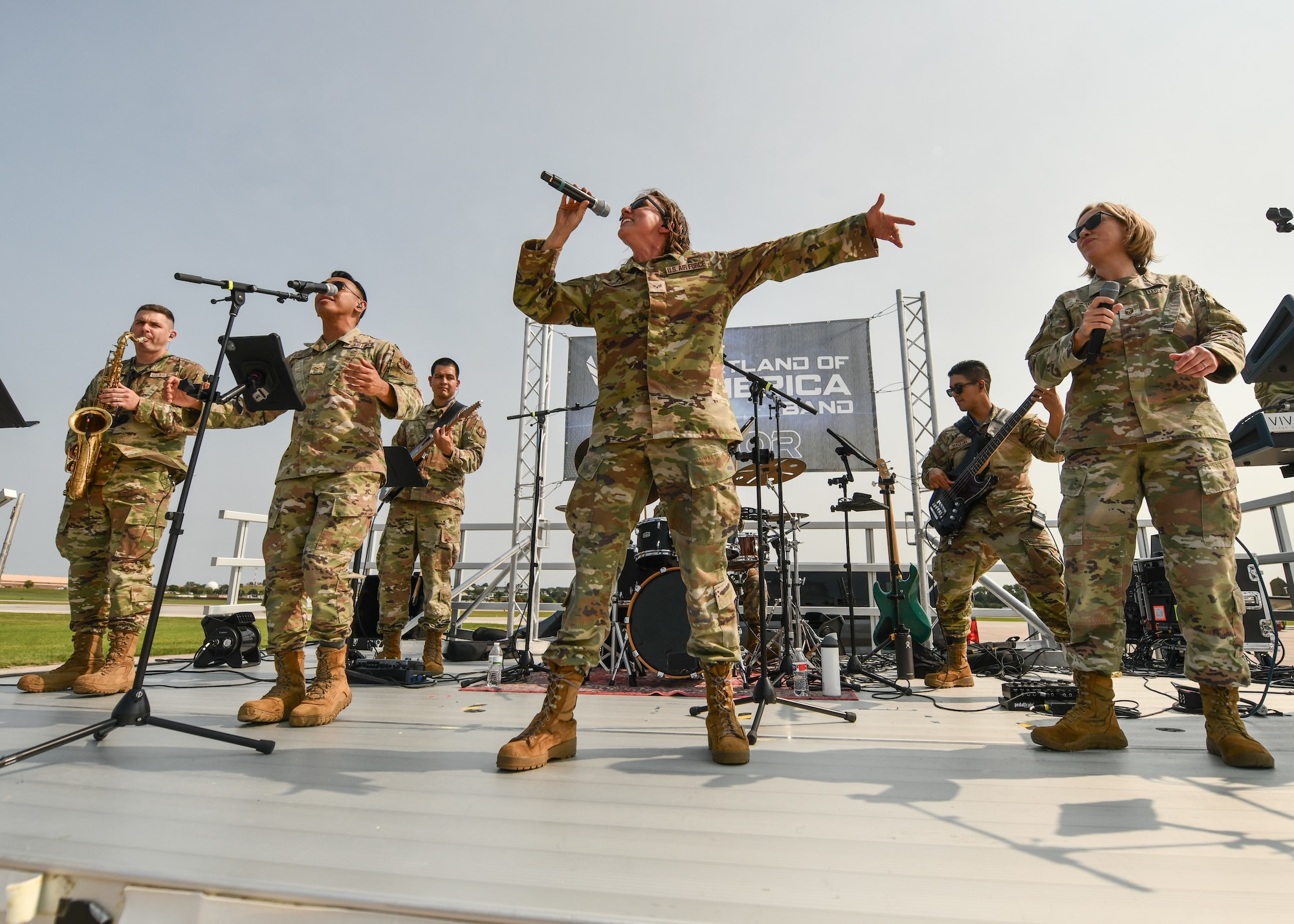 The U.S. Air Force Heartland of America Band performs before the opening ceremony during the 2026 Defenders of Freedom Air & Space Show at Offutt Air Force Base, Nebraska, Aug. 8, 2026. The open house provided a rare opportunity for local Greater Omaha residents to interact directly with service members, ask questions, and explore the military aircraft that make the nation's global defense possible. (U.S. Air Force photo by Chad Watkins)