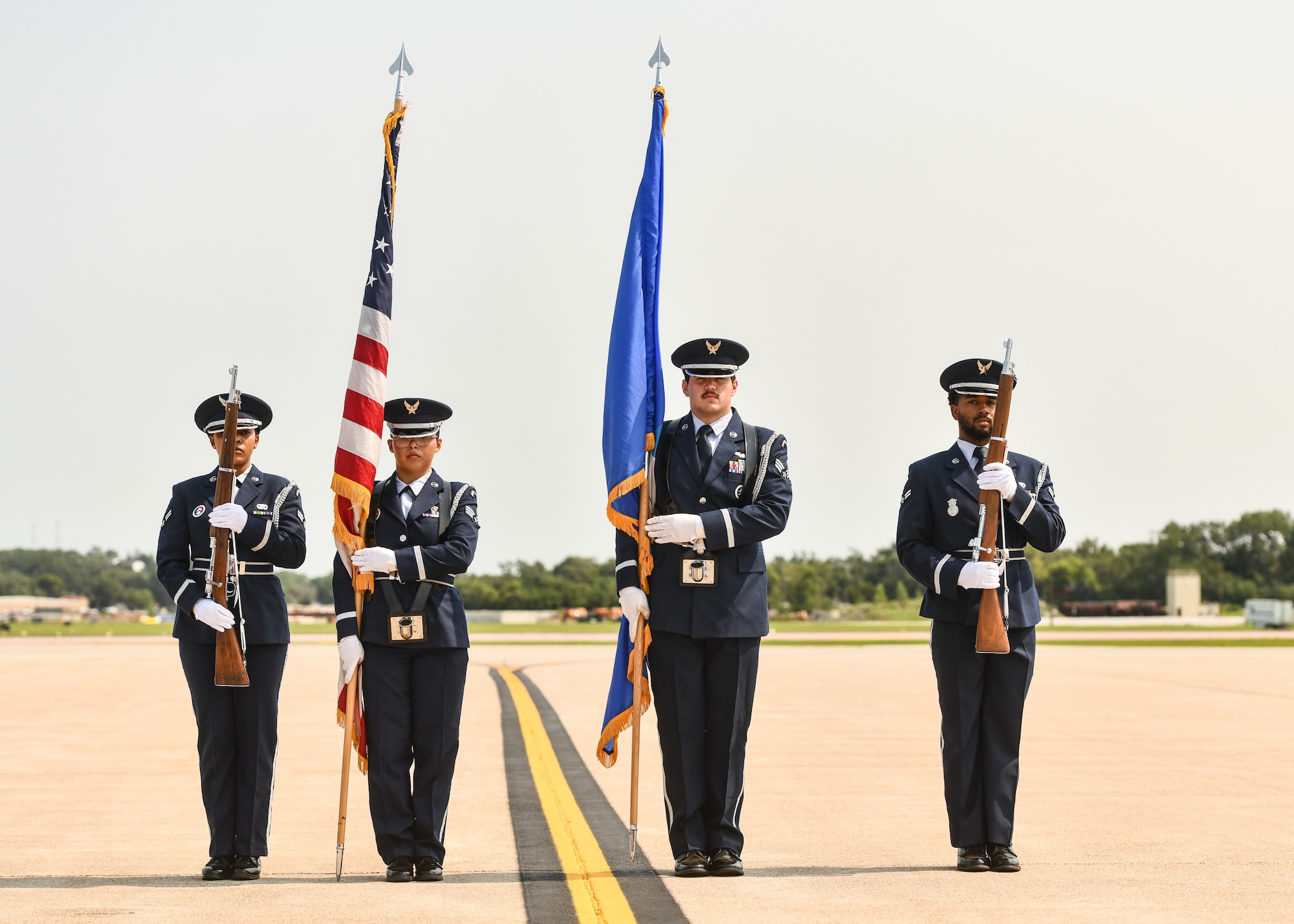 Offutt Air Force Base Honor Guard members present the colors during the 2026 Defenders of Freedom Air & Space Show at Offutt Air Force Base, Nebraska, Aug. 8, 2026. In alignment with the nationwide 'Freedom 250' celebration, the air show highlighted two and a half centuries of American progress, liberty, and the technological leaps made throughout military aviation history. (U.S. Air Force photo by Chad Watkins)