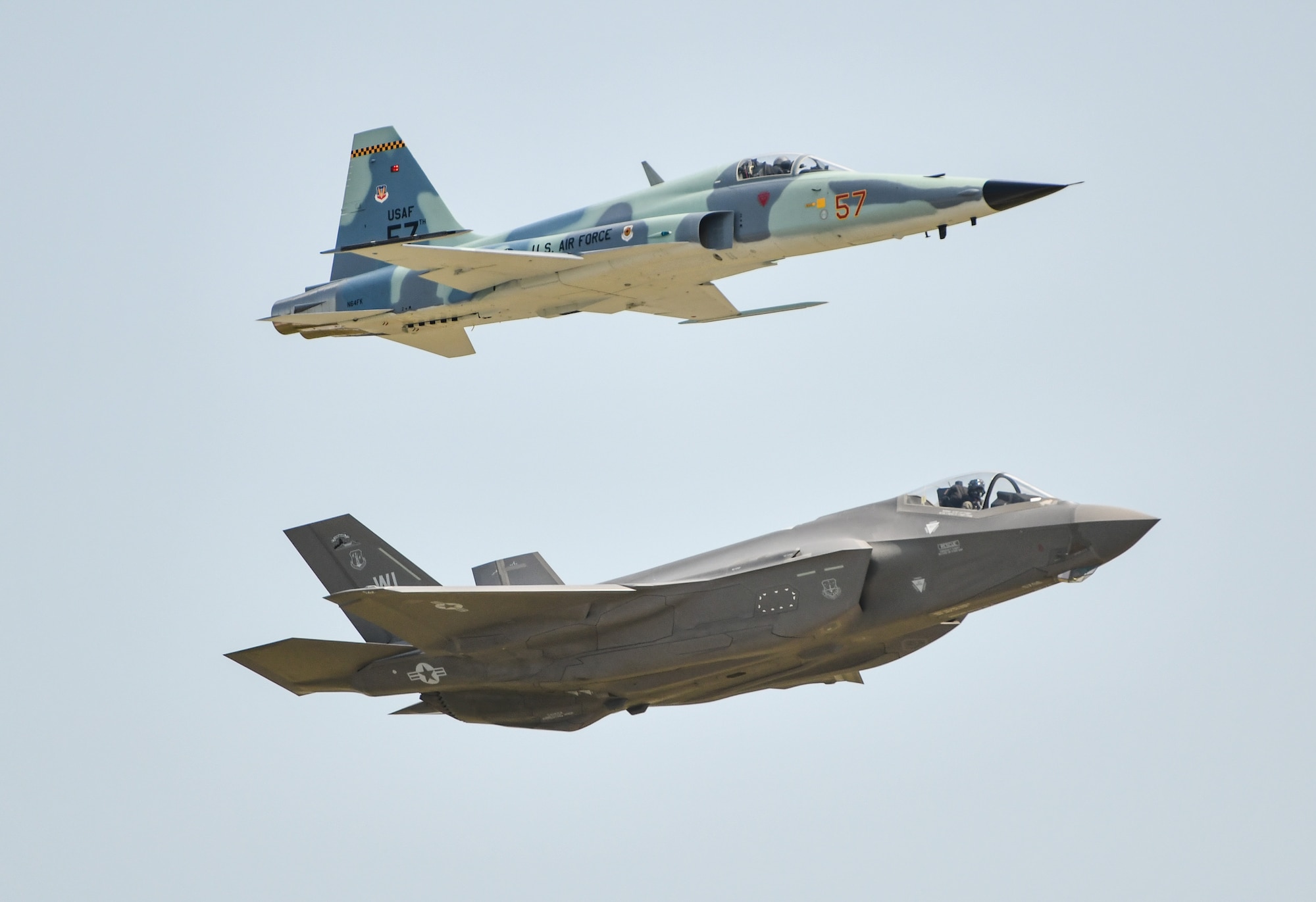 An F-5 Tiger II and a U.S. Air Force F-35A Lightning II fly in a heritage formation during the 2026 Defenders of Freedom Air & Space Show at Offutt Air Force Base, Nebraska, Aug. 7, 2026.The event highlighted the historic evolution of military aviation, bridging the gap between legacy heritage platforms and modern combat capabilities to preserve and share military history. (U.S. Air Force photo by Chad Watkins)