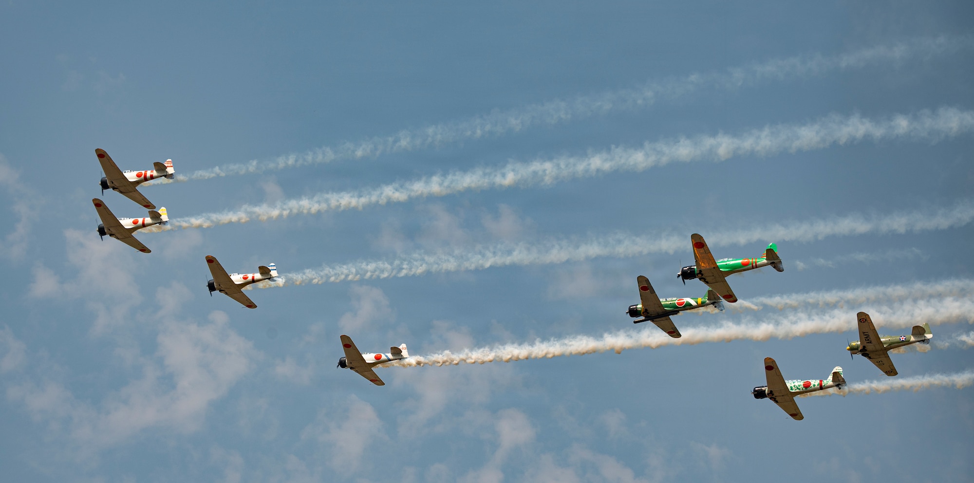TORA! TORA! TORA! performs a synchronized flyover at the 2026 Defenders of Freedom Air & Space Show at Offutt Air Force Base, Nebraska, Aug. 9, 2026. In alignment with the nationwide 'Freedom 250' celebration, the air show highlighted two and a half centuries of American progress, liberty, and the technological leaps made throughout military aviation history. (U.S. Air Force photo by Senior Airman Matthew Arachikavitz)