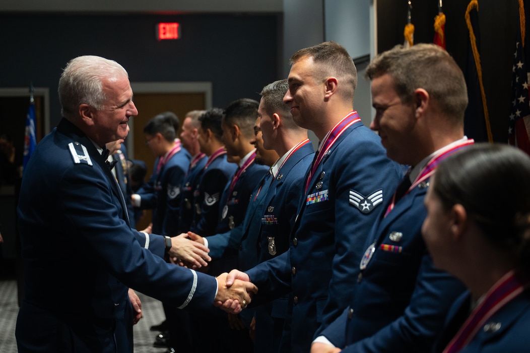 U.S. Air Force Col. Matthew Norton, 17th Training Wing commander, shakes hands with Senior Airman Brayden Garner, 47th Contracting Squadron contracting specialist, after an ALS graduation at Goodfellow Air Force Base, Texas, Aug. 6, 2026. ALS graduation ceremonies are held to give leadership, family, friends and coworkers the opportunity to celebrate with and congratulate the graduates on one of the most important milestones in their Air Force career. (U.S. Air Force photo by Senior Airman Brian Lummus)
