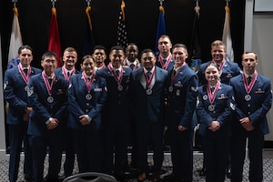 Airman Leadership School Class 26-E pose for a group photo after an ALS graduation at Goodfellow Air Force Base, Texas, Aug. 6, 2026. ALS provides Airmen and Guardians with a deeper understanding of their role as military supervisors and the impact they have on accomplishing the Air Force mission. (U.S. Air Force photo by Senior Airman Brian Lummus)