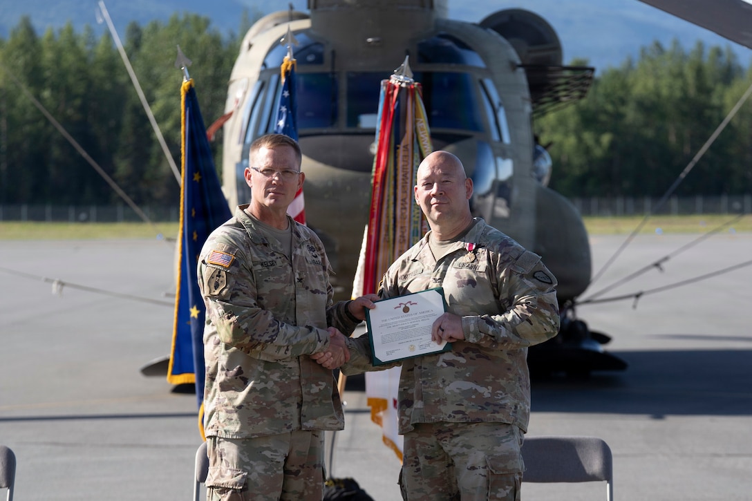 Kang succeeds Mortrud as 38th Troop Command commander