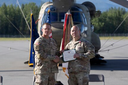 Kang succeeds Mortrud as 38th Troop Command commander