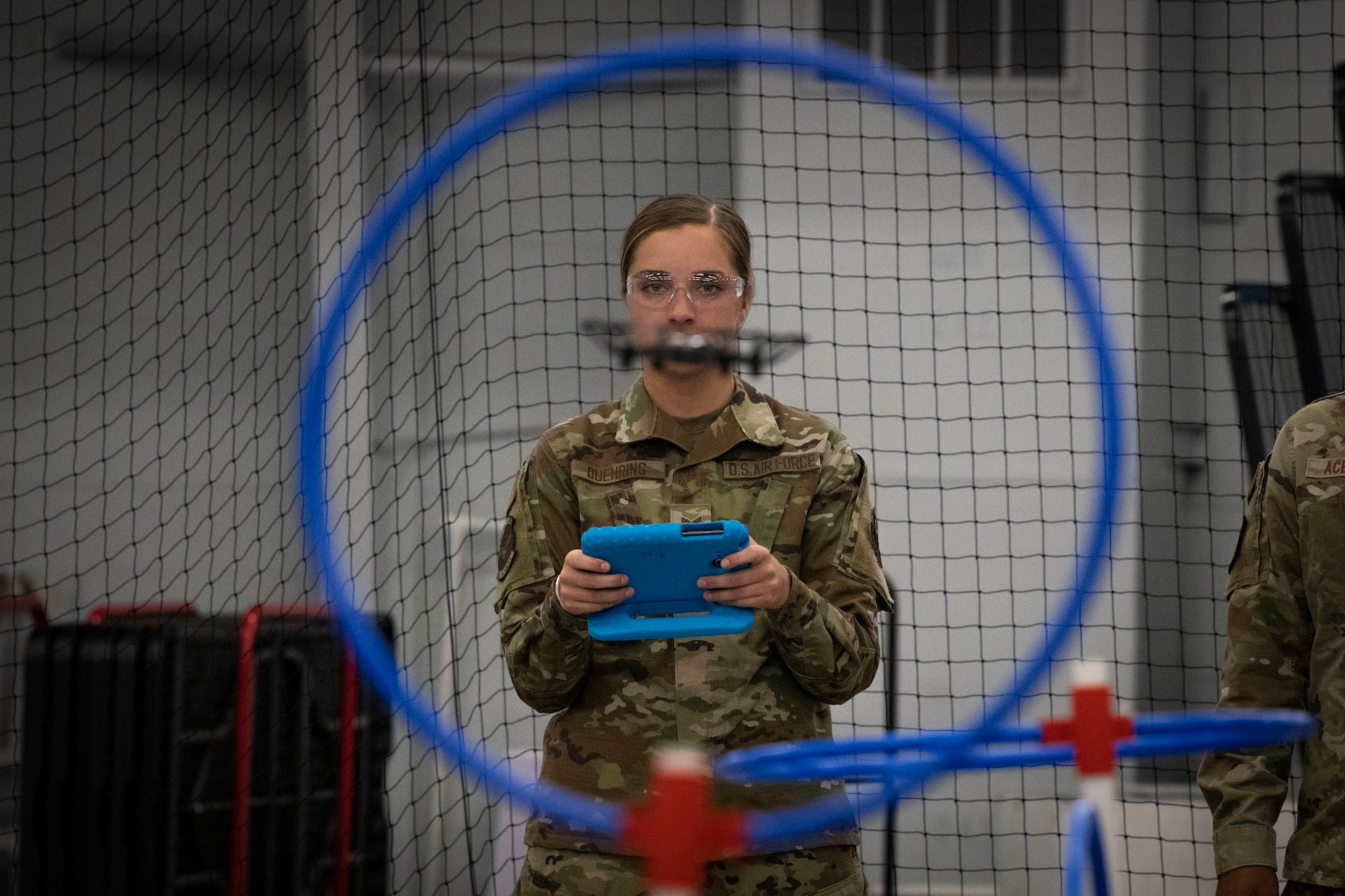U.S. Air Force Senior Airman Sylis Duehring, 2021 Air Force Operations Command honor guardsman of the year, flies a drone May 11, 2022, at the HSU Innovation Institute in Fort Walton Beach, Florida. The award winners experienced what several organizations at and around Hurlburt Field have to offer as recognition for their contributions to the command. (U.S. Air Force photo by Staff Sgt. Miranda Mahoney)