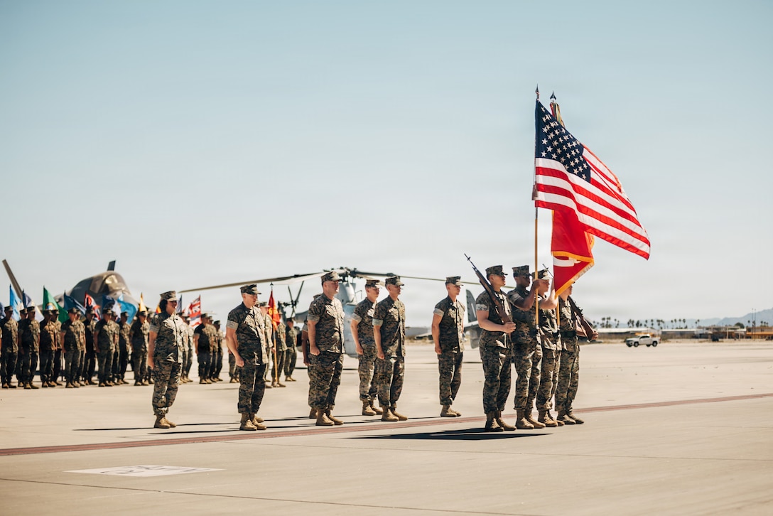 The Marine Aviation Weapons and Tactics Squadron One (MAWTS-1) color guard presents the colors during a change of command ceremony at Marine Corps Air Station Yuma, Arizona, May 1, 2026. The MAWTS-1 change of command ceremony marked the official passing of authority from the outgoing commanding officer, Col. Joshua M. Smith to the incoming commanding officer, Col. Phillip T. Ash. (U.S. Marine Corps photo by Cpl. Micah Thompson)