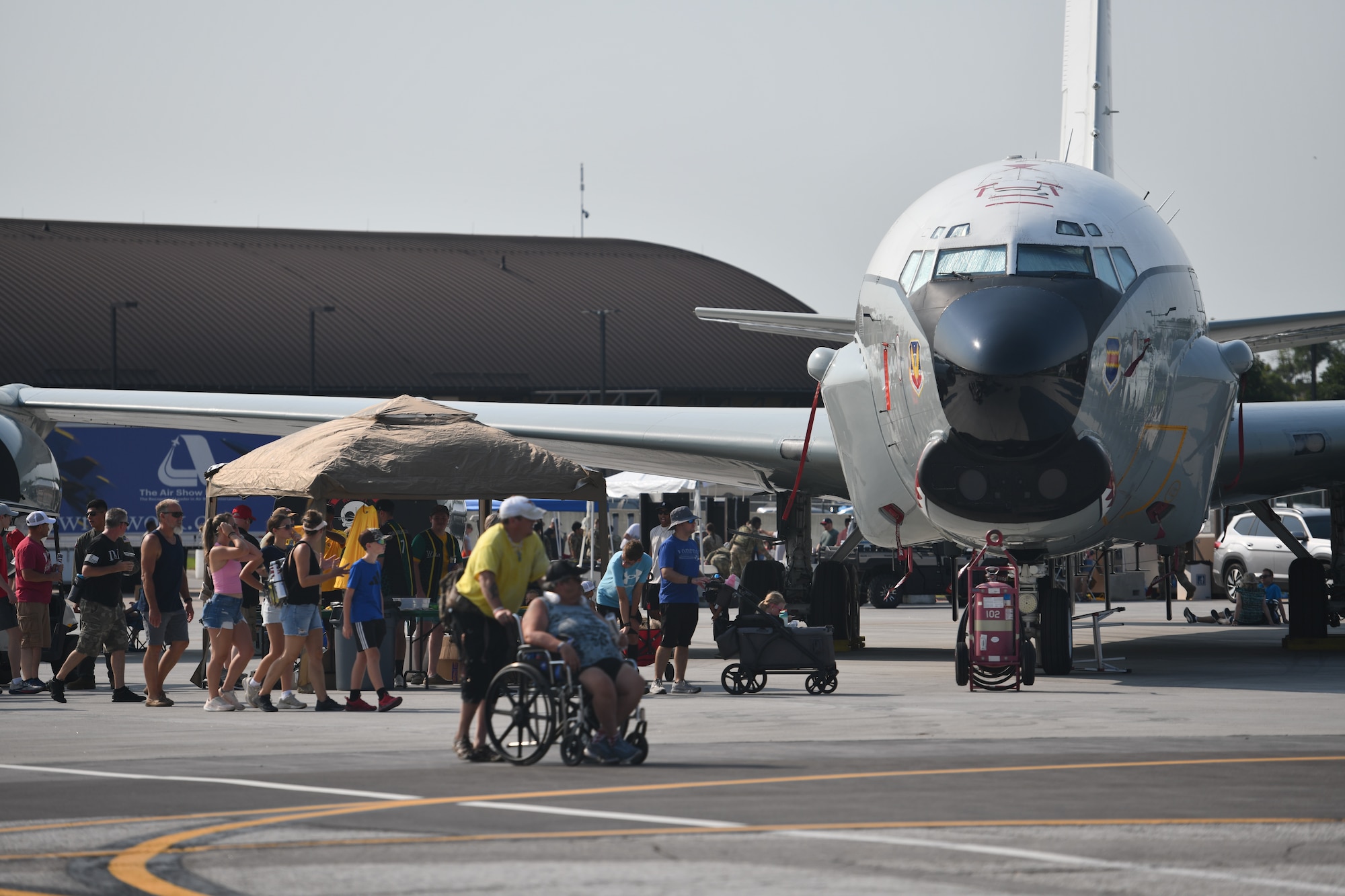 A crowd of people walk by an RC-135U Combat Sent during the 2026 Defenders of Freedom Air & Space Show at Offutt Air Force Base, Nebraska, Aug. 9, 2026. Defenders of Freedom Air & Space Show 2026 served as a free, public open house to foster strong community relations and express appreciation to the local Greater Omaha community. (U.S. Air Force photo by Chad Watkins)