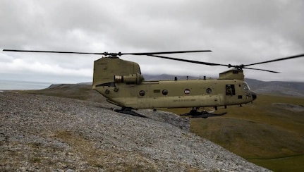 A CH-47 Chinook performs a pinnacle landing in Alaska.