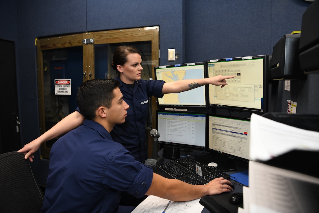 Petty Officer 2nd Class Shana Stanford and Petty Officer 3rd Class Victor Velasquez stand the watch as operations specialists in the command center of Coast Guard Sector Hampton Roads in Portsmouth, Virginia, March 20, 2019. Operations specialist is one of four critical ratings for Coast Guard recruiting efforts. U.S. Coast Guard photo by Matt Sprague.