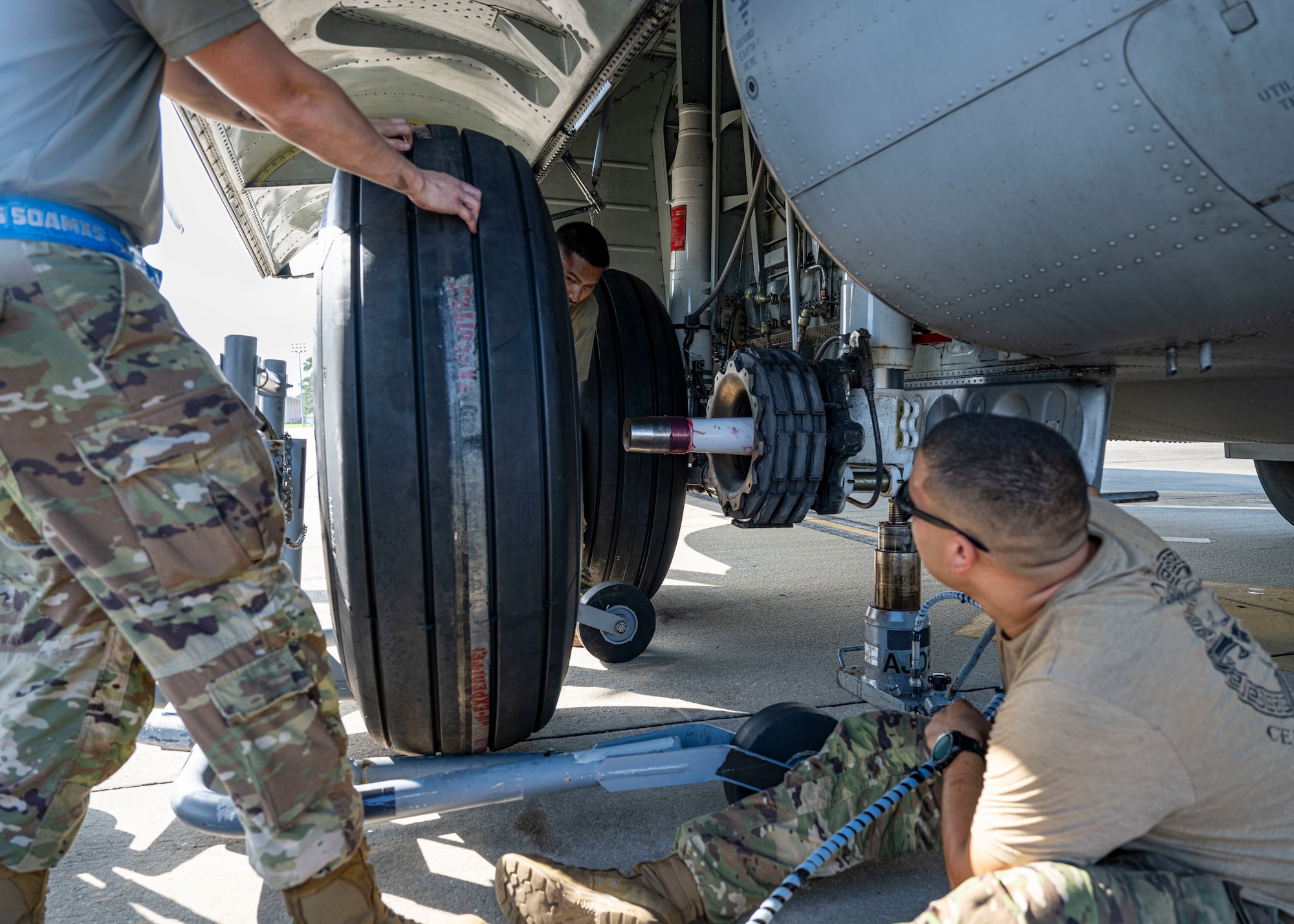 A maintenance technician assigned to the 1st Special Operations Wing aligns a tire for installation on an MC-130J Commando II at Hurlburt Field, Florida, June 17, 2026.