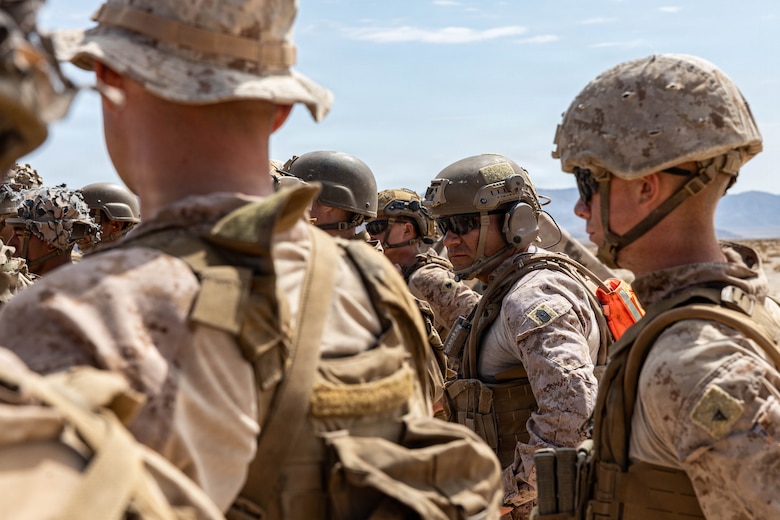 U.S. Marine Corps Sgt. Maj. Roberto Lopez, sergeant major of Marine Air Ground Task Force Training Command and Marine Corps Air Ground Combat Center, observes a safety brief during Counter-small Unmanned Aerial System training as part of Service Level Training Exercise 4-26 at Training Area Prospect, Marine Corps Air Ground Combat Center, Twentynine Palms, California, July 17, 2026. With the debut of C-sUAS lanes at the Combat Center, Marines recognize and respond to unmanned aerial threats by employing emerging tactics, techniques, procedures, and maintaining a C-sUAS mindset in every operation, all while preserving the fundamentals that make rifle squads survivable and lethal. SLTE is a premier training event that ensures the Marine Corps remains a highly lethal, adaptable force capable of dominating the future multi-domain fight. (U.S. Marine Corps photo by Lance Cpl. Cody Fitzgerald)