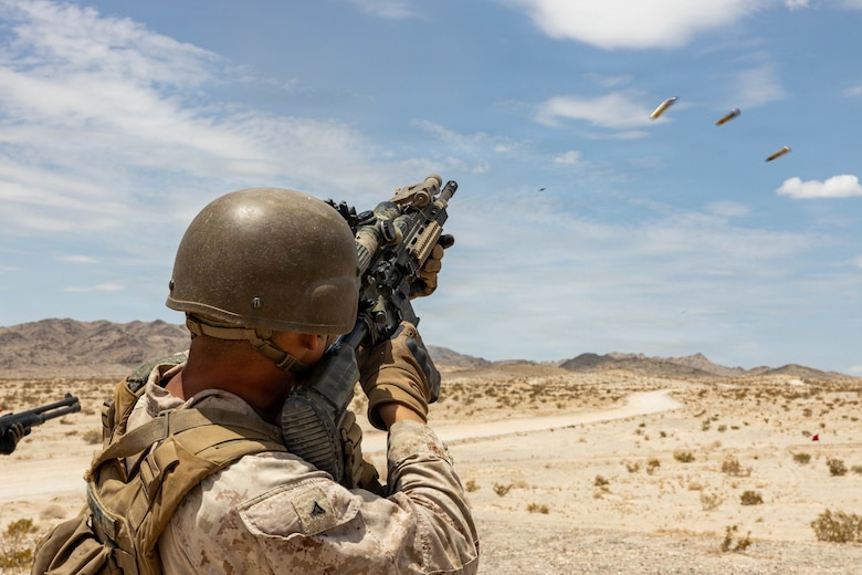 U.S. Marine Corps Lance Cpl. Jeremiah Smith, an Arizona native, an infantry Marine with 2nd Battalion, 5th Marine Regiment, 1st Marine Division, fires a M27 Infantry Automatic Rifle during Counter-small Unmanned Aerial System training as part of Service Level Training Exercise 4-26 at Training Area Prospect, Marine Corps Air Ground Combat Center, Twentynine Palms, California, July 17, 2026. With the debut of C-sUAS lanes at the Combat Center, Marines recognize and respond to unmanned aerial threats by employing emerging tactics, techniques, procedures, and maintaining a C-sUAS mindset in every operation, all while preserving the fundamentals that make rifle squads survivable and lethal. SLTE is a premier training event that ensures the Marine Corps remains a highly lethal, adaptable force capable of dominating the future multi-domain fight. (U.S. Marine Corps photo by Lance Cpl. Cody Fitzgerald)