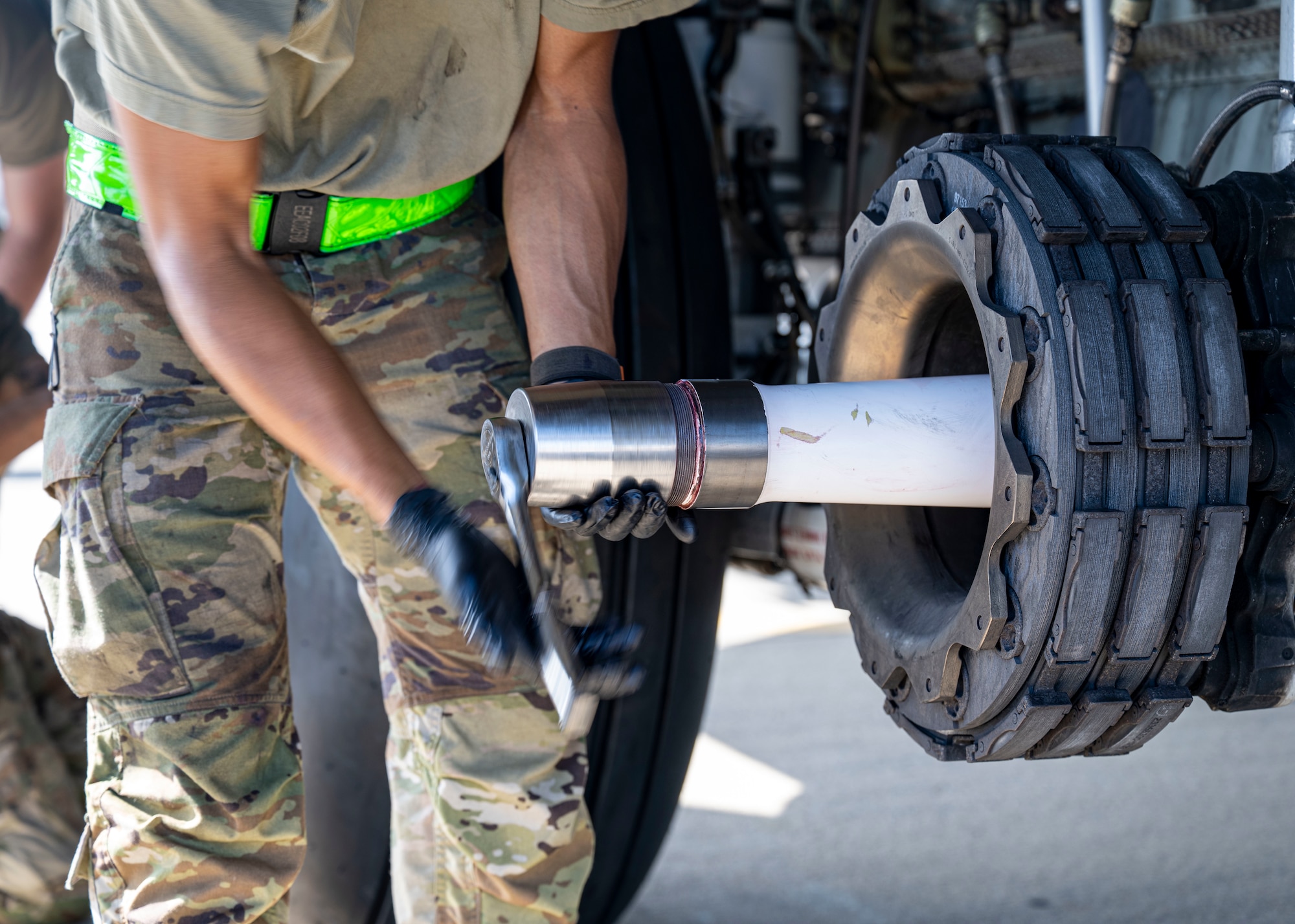 A maintenance technician assigned to the 1st Special Operations Wing replaces a tire on an MC-130J Commando II at Hurlburt Field, Florida, June 17, 2026.