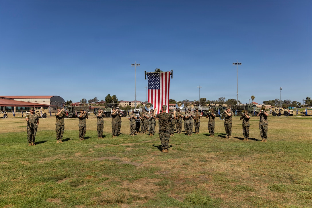 U.S. Marines with the 1st Marine Division Band play music during a change of command ceremony for Combat Logistics Regiment 1, 1st Marine Logistics Group on Marine Corps Base Camp Pendleton, California, July 23, 2026.