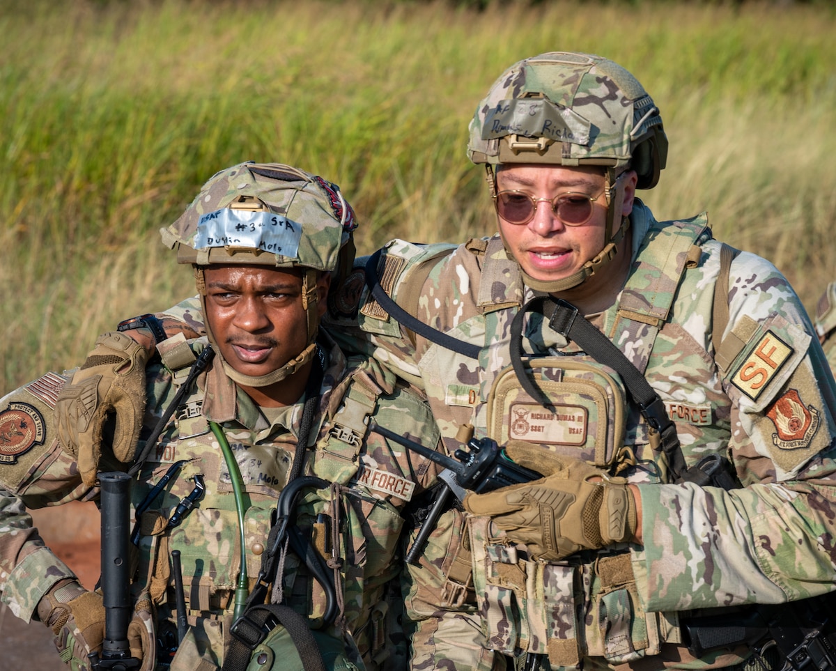 Airman carrying a simulated wounded Airman