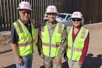 Left to right: South Pacific Border Project Manager Mike Tuttle, South Pacific Border Task Force Commander Col. Andrew Sinelli, and Angela Tugaoen, area engineer, oversee the installation of the final border barrier panel at the National Defense Area One, or NDA-1, project site July 17 near Antelope Wells, New Mexico. USACE completed installation of border barriers along the southern border of the U.S. at the direction of the U.S. Army by the Secretary of War, in response to the presidential national emergency declaration dated Jan. 20, 2025, authorizing the use of Section 2808 of Title 10, U.S. Code.