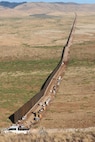 The U.S. Army Corps of Engineers South Pacific Border Task Force completed border barrier installation at the National Defense Area One, or NDA-1, project site July 17 near Antelope Wells, New Mexico. The NDA-1 project consists of approximately six miles of new permanent border barrier with access gates, patrol roadways, and access improvements through the Roosevelt Reservation Corridor in Hidalgo County. USACE is installing border barriers along the southern border of the U.S. at the direction of the U.S. Army by the Secretary of War, in response to the presidential national emergency declaration dated Jan. 20, 2025, authorizing the use of Section 2808 of Title 10, U.S. Code. (No one in this image crossed the international border)