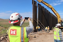 The U.S. Army Corps of Engineers South Pacific Border Task Force installs the final border barrier panel at the National Defense Area One, or NDA-1, project site July 17 near Antelope Wells, New Mexico. The NDA-1 project consists of installation of up to six miles of new permanent border barrier with access gates, patrol roadways and access improvements. USACE is installing border barriers along the southern border of the U.S. at the direction of the U.S. Army by the Secretary of War, in response to the presidential national emergency declaration dated Jan. 20, 2025, authorizing the use of Section 2808 of Title 10, U.S. Code. (No one in this image crossed the international border)