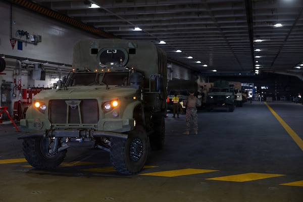 U.S. Marine Corps tactical vehicles are staged aboard the Royal Australian Navy HMAS Canberra as Marines with Combat Logistics Battalion 5, Marine Rotational Force – Darwin 26, prepare to embark at the Port of Townsville in Queensland, Australia, August 2, 2026.