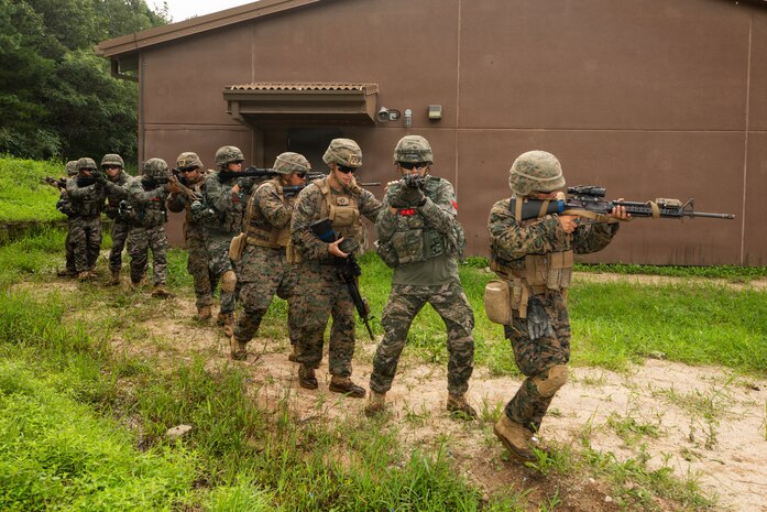 U.S. Marines with 9th Engineer Support Battalion, 3rd Marine Logistics Group, and members of the Republic of Korea Marine Corps maneuver toward a building during bilateral breaching training at Rodriguez Live Fire Complex, South Korea, July 28, 2026.