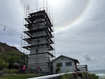 Scaffolding is being installed to facilitate maintenance and repairs at historic Diamond Head Lighthouse, Honolulu, Aug. 3, 2026. The 55-foot tower of the current Diamond Head Lighthouse was constructed in 1917. (U.S. Coast Guard photo, courtesy of Coast Guard Civil Engineering Unit Honolulu)