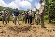 Jonathon Guthrie, left, global director for operations at Norwegian People’s Aid; U.S. Army Maj. Gen. Lance Okamura, middle, deputy commanding general for U.S. Army Pacific (USARPAC) Homeland Affairs; Jennifer Anson, right, national security coordinator for the Republic of Palau; and U.S. Soldiers assigned to the 74th Explosive Ordnance Disposal Company (EOD), 303rd EOD Battalion, 8th Military Police Brigade, 8th Theater Sustainment Command, check the detonation site after the disposal of unexploded World War II-era white phosphorus munition in Koror, Palau, Aug. 2, 2026.
