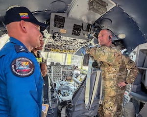 Lt. Col. Tim Ori, right, officer in charge of a Kentucky National Guard 123rd Medical Group Critical Care Air Transport Team, meets with members of the Ecuadorian Air Force during a five-day information exchange in Ecuador.