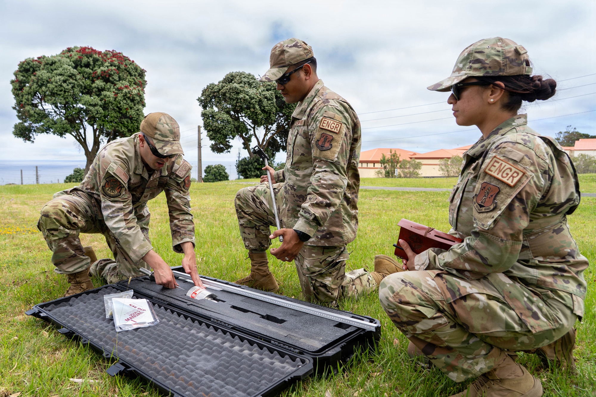 U.S. Air National Guard Airman 1st Class Maria Del Carmen Dominguez, right, an engineering assistant with the 142nd Civil Engineer Squadron, observes fellow civil engineers assembling a dynamic cone penetrometer during a Deployment for Training, or DFT, at Lajes Air Base, Portugal, June 23, 2026.