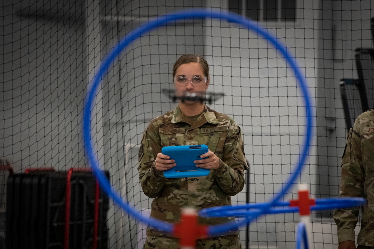 U.S. Air Force Senior Airman Sylis Duehring, 2021 Air Force Operations Command honor guardsman of the year, flies a drone May 11, 2022, at the HSU Innovation Institute in Fort Walton Beach, Florida. The award winners experienced what several organizations at and around Hurlburt Field have to offer as recognition for their contributions to the command. (U.S. Air Force photo by Staff Sgt. Miranda Mahoney)