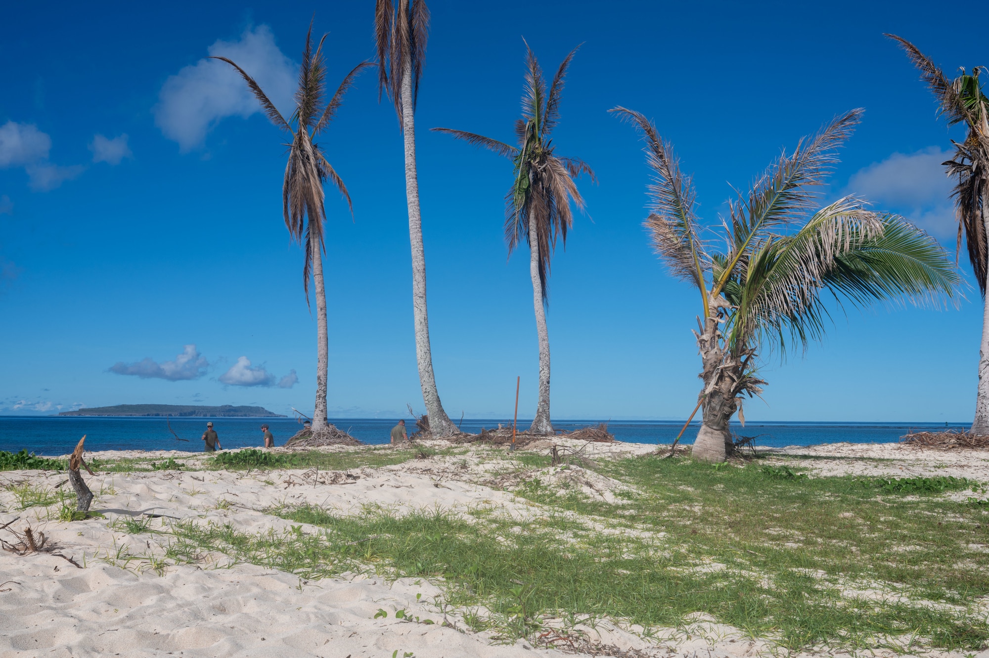 A public beach on Tinian, Commonwealth of the Northern Mariana Islands, stands clear of storm debris, June 11, 2026. Members of the 21st Combat Air Base Squadron cleared wreckage from public coastlines in the CNMI following the landfall of Typhoon Sinlaku. These efforts, conducted in support of the Federal Emergency Management Agency, restored recreational and essential public spaces, reinforcing the deep trust and partnership between the Department of War and local communities. (U.S. Air Force photo by Senior Airman Alondra Cristobal)