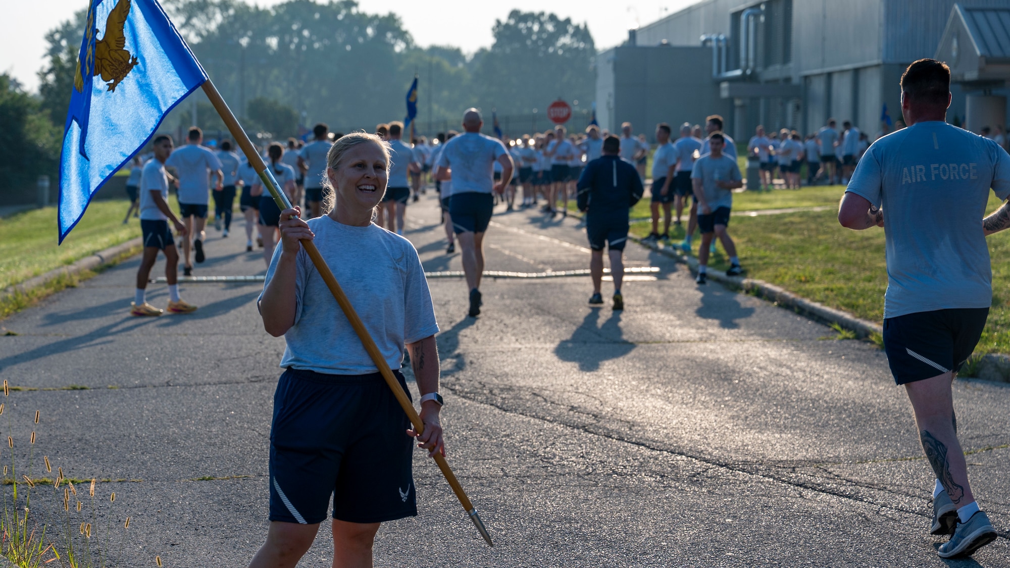Chief Master Sgt. Tabatha Sanders encourages runners during the NASIC run.