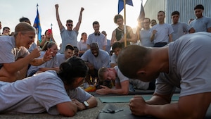 Airmen of the National Air and Space Intelligence Center compete to see who can hold the plank position.