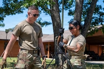 U.S. Air National Guard Staff Sgt. Seth Henning and Senior Airman Shylie Polodna, Missouri National Guard's 239th Combat Communications Squadron, build a radio frequency kit during Exercise Northern Strike 26-2 at Alpena Combat Readiness Training Center, Michigan, Aug. 3, 2026.