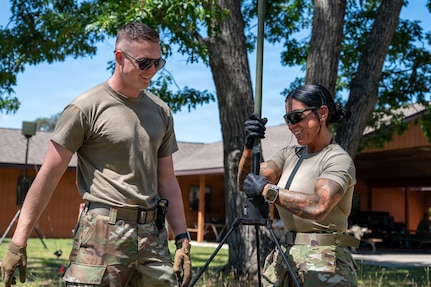 U.S. Air National Guard Staff Sgt. Seth Henning and Senior Airman Shylie Polodna, Missouri National Guard's 239th Combat Communications Squadron, build a radio frequency kit during Exercise Northern Strike 26-2 at Alpena Combat Readiness Training Center, Michigan, Aug. 3, 2026.