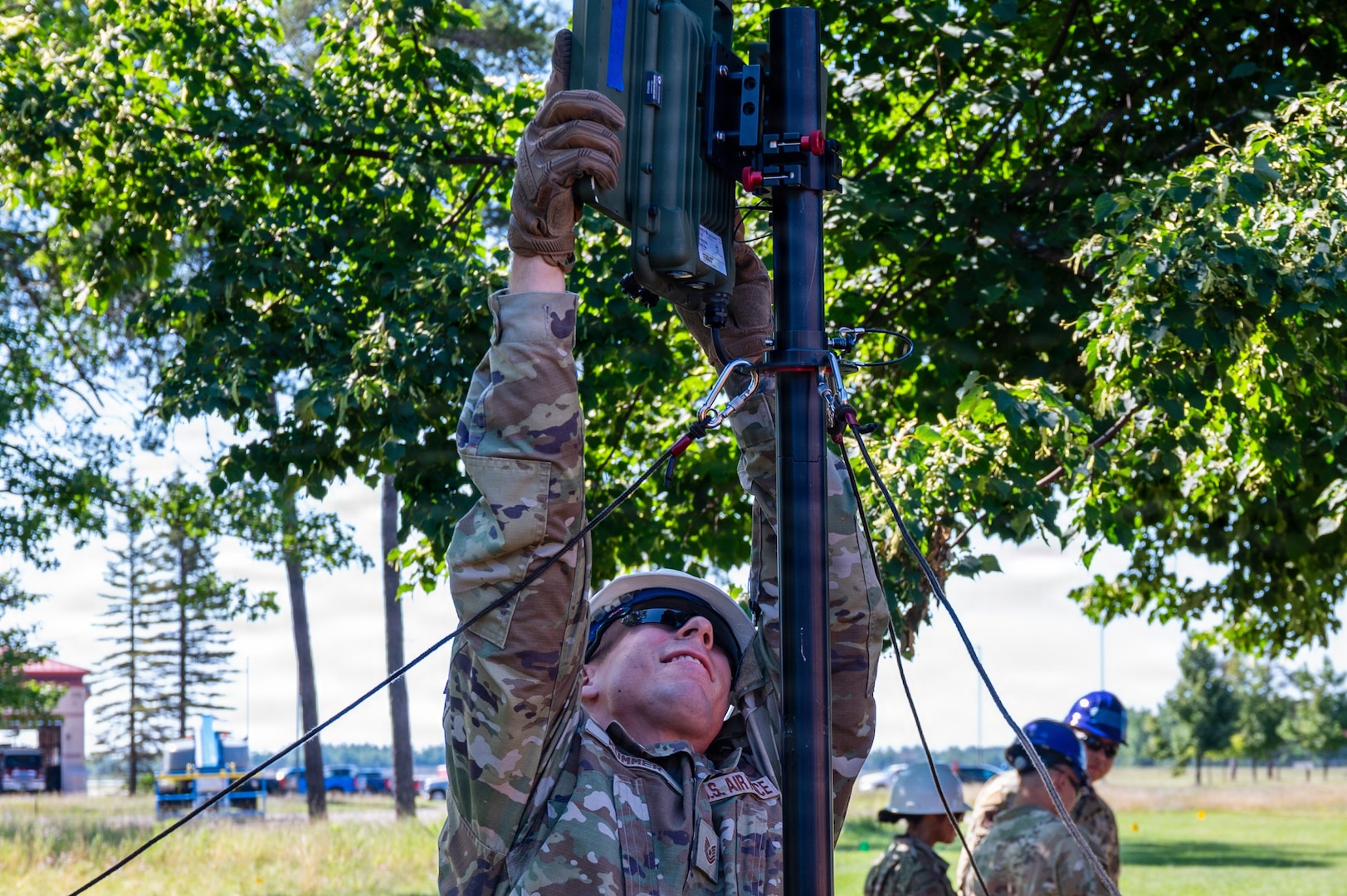 Airmen from the 239th Combat Communications Squadron, Missouri Air National Guard; the 264th Combat Communications Squadron, Illinois Air National Guard; and the 293rd Combat Communications Squadron, Guam Air National Guard build a radio frequency kit during Exercise Northern Strike 26-2 at Alpena Combat Readiness Training Center, Michigan, Aug. 3, 2026.