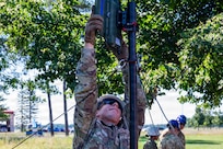 Airmen from the 239th Combat Communications Squadron, Missouri Air National Guard; the 264th Combat Communications Squadron, Illinois Air National Guard; and the 293rd Combat Communications Squadron, Guam Air National Guard build a radio frequency kit during Exercise Northern Strike 26-2 at Alpena Combat Readiness Training Center, Michigan, Aug. 3, 2026.
