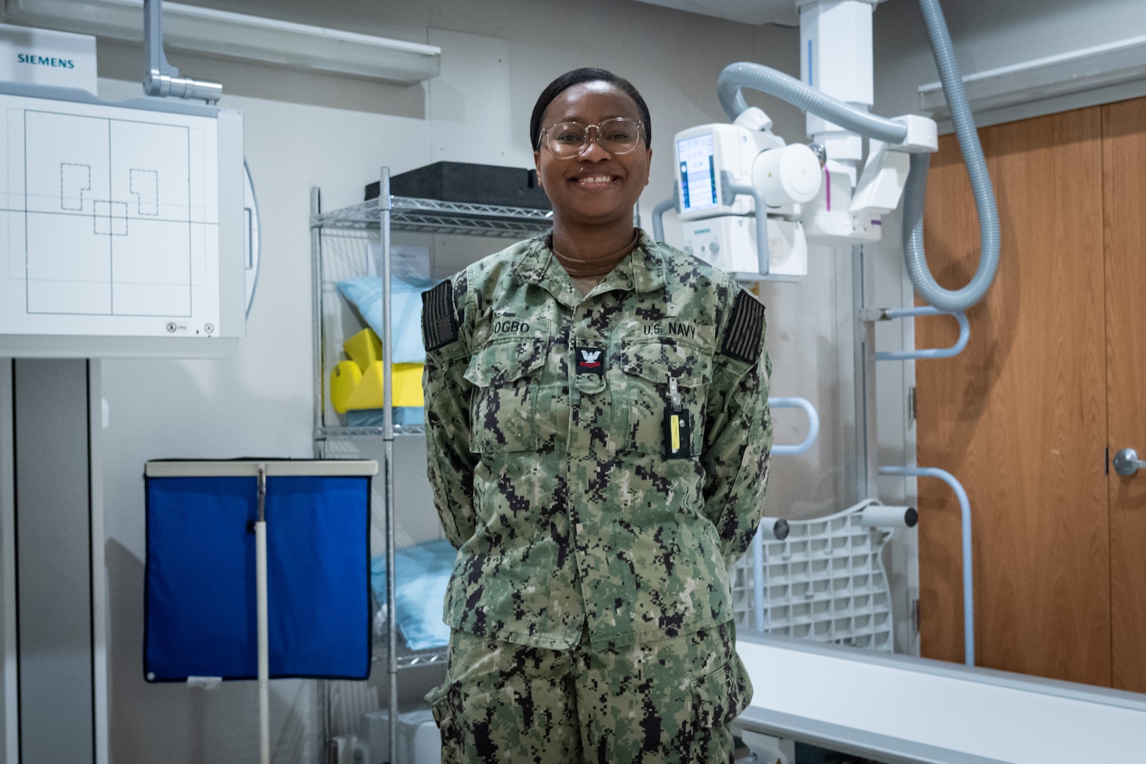 Hospital Corpsman 2nd Class Emmanuella Gbogbo serves as a radiology technologist and the leading petty officer of Navy Medicine Readiness and Training Command Cherry Point’s radiology department.  
A native of Ghana, West Africa, Gbogbo leads a team whose work provides rapid, accurate imaging to assist in the diagnosis and treatment of service members’ injuries to return them to full duty status as quickly as possible.